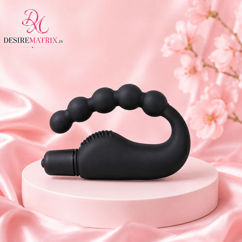 Vibrating anal bead strand with graduated beads and retrieval ring