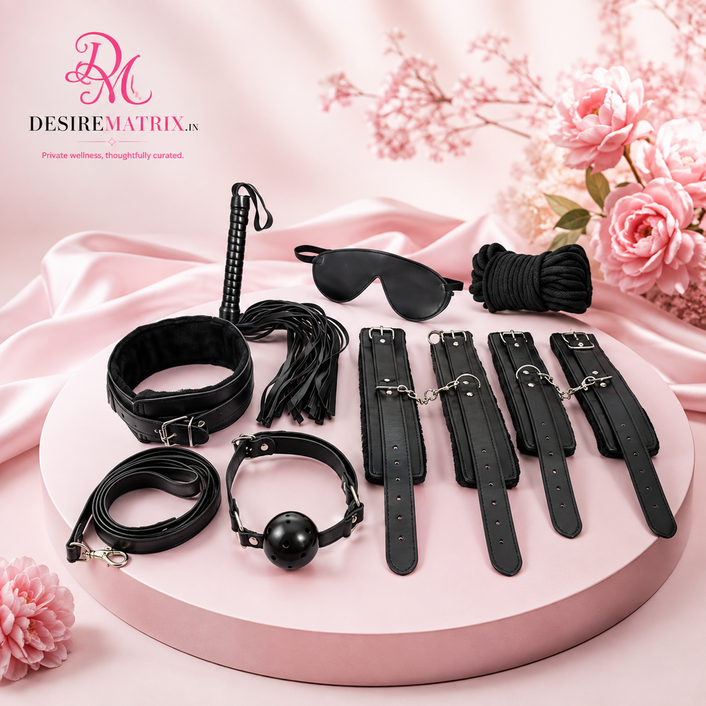 Seven piece bedroom bondage kit laid out with cuffs, collar, blindfold and flogger