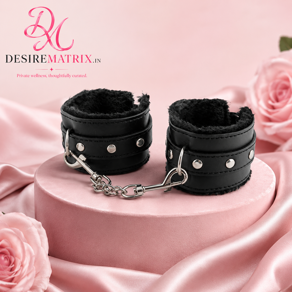 Black PU leather wrist cuffs with soft fur lining and buckle fastening