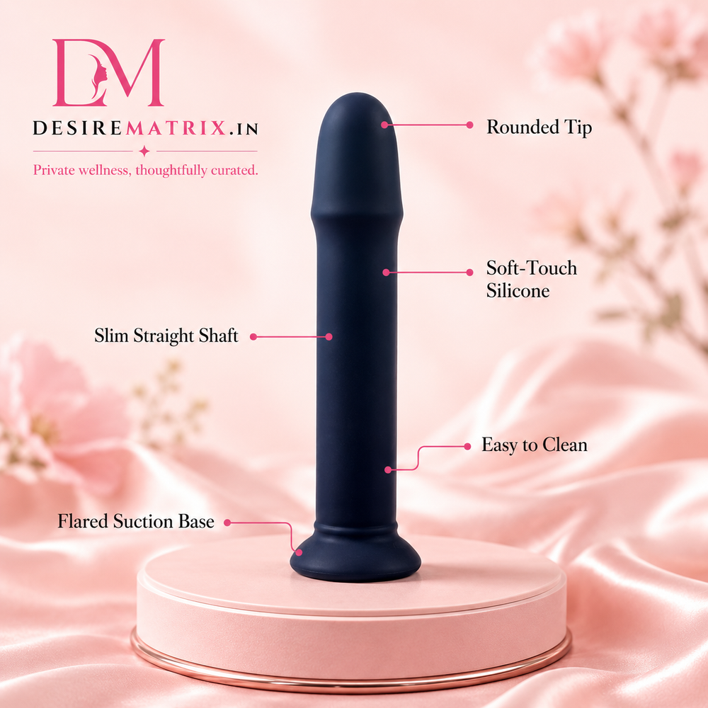 Black strap-on dildo shown upright with its flared base