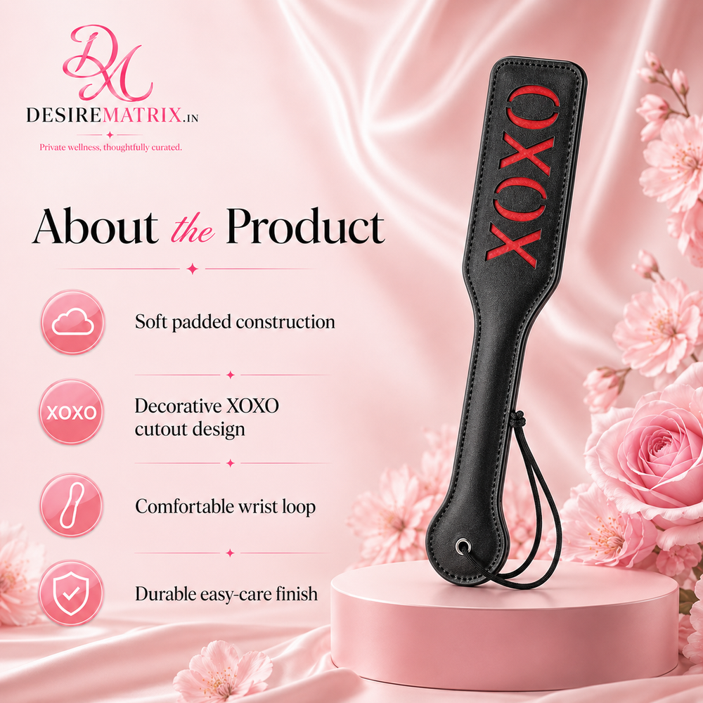 XOXO spanking paddle shown flat with wrist loop attached