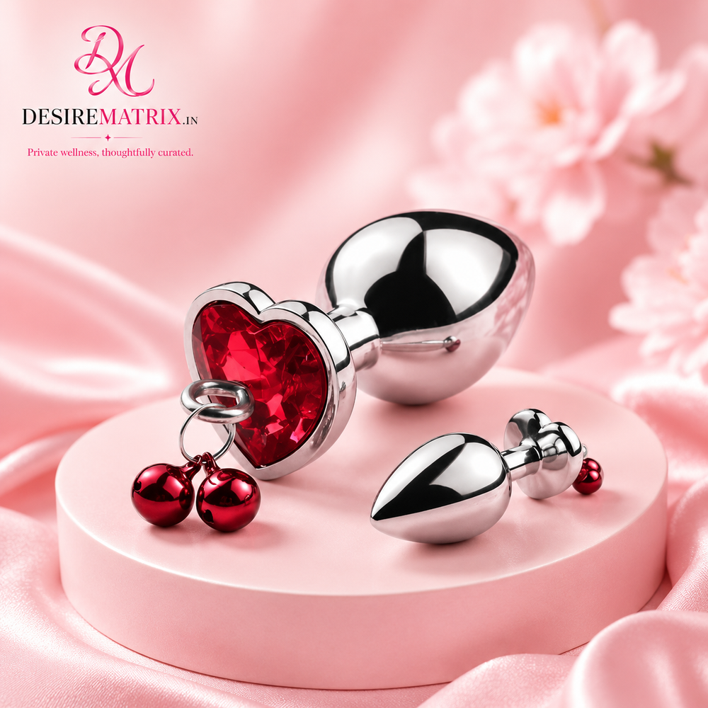 Stainless steel anal plug with heart-shaped base and pull ring