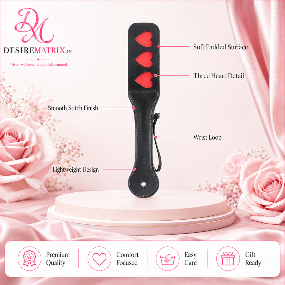 Hearts spanking paddle shown flat with its 7.5 inch handle