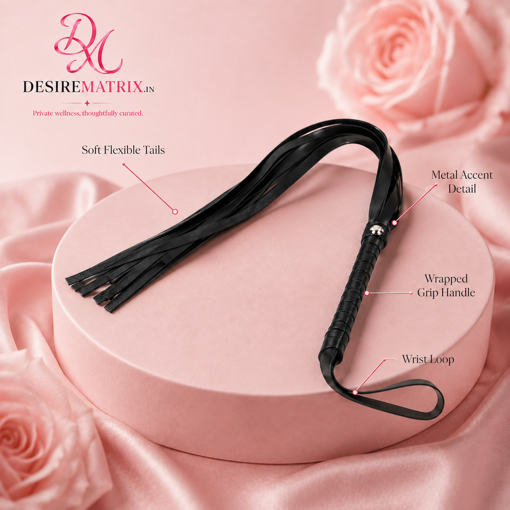Black flogger shown full length with the tails spread