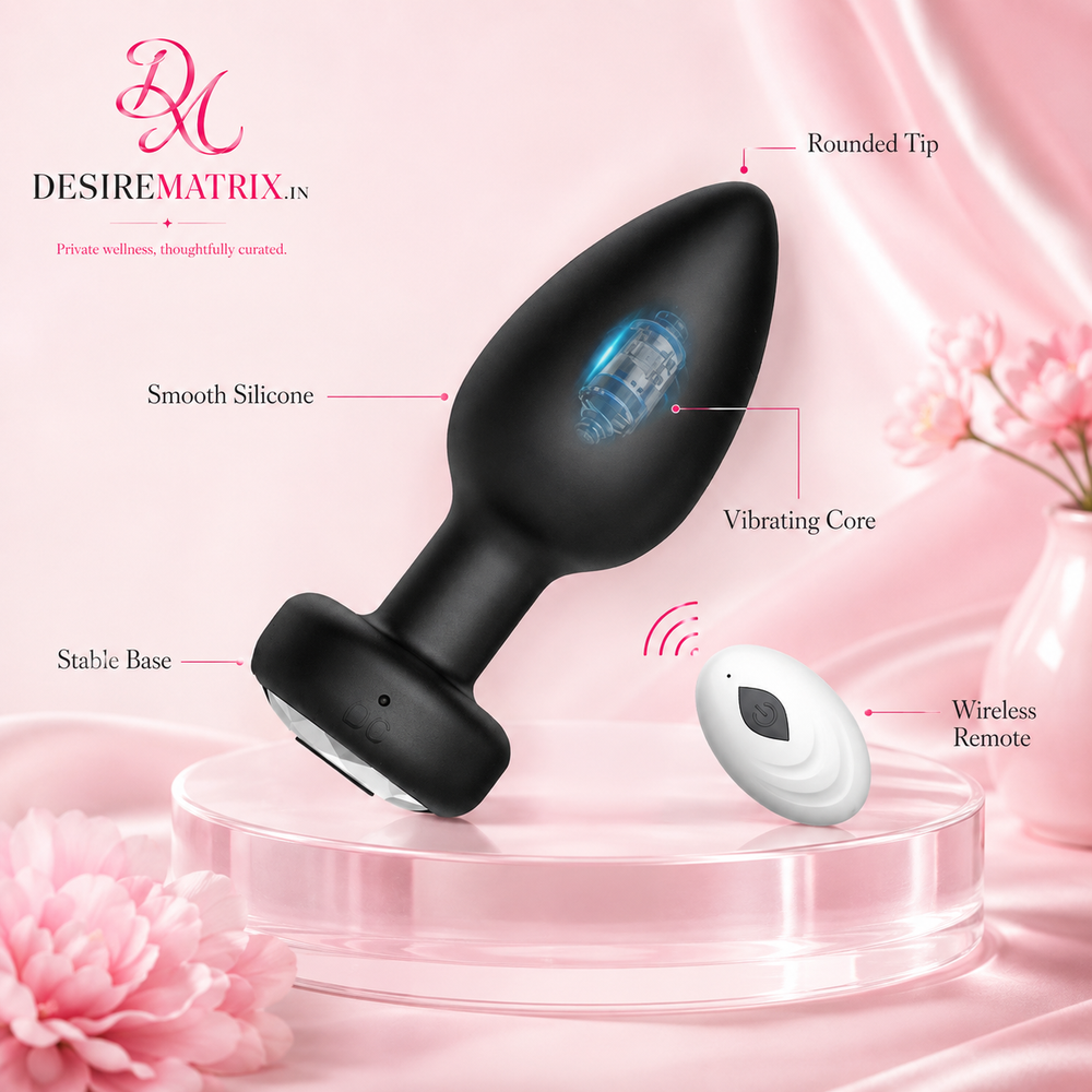 Vibrating butt plug shown beside its wireless remote