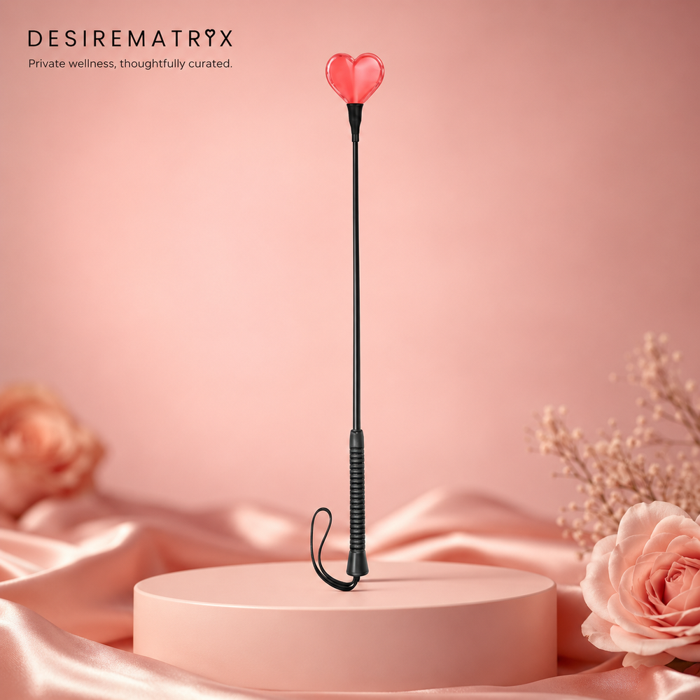 Red heart-shaped spanking paddle in PU leather with wrist strap